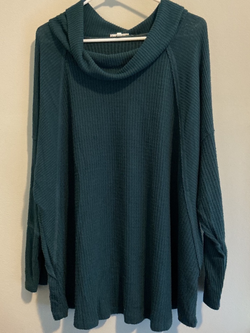 Maurice’s green cowl neck top.